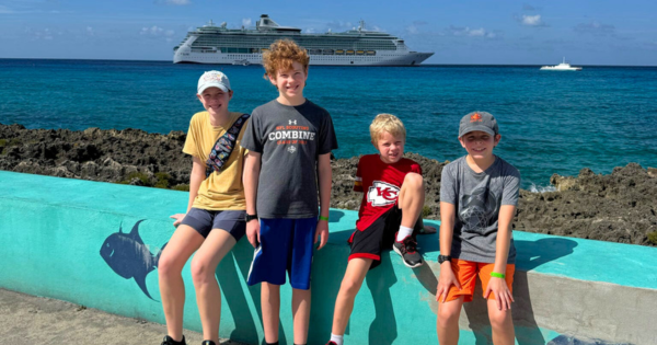 Picture of Joy Oufnac's kids in front of a Cruise Ship.